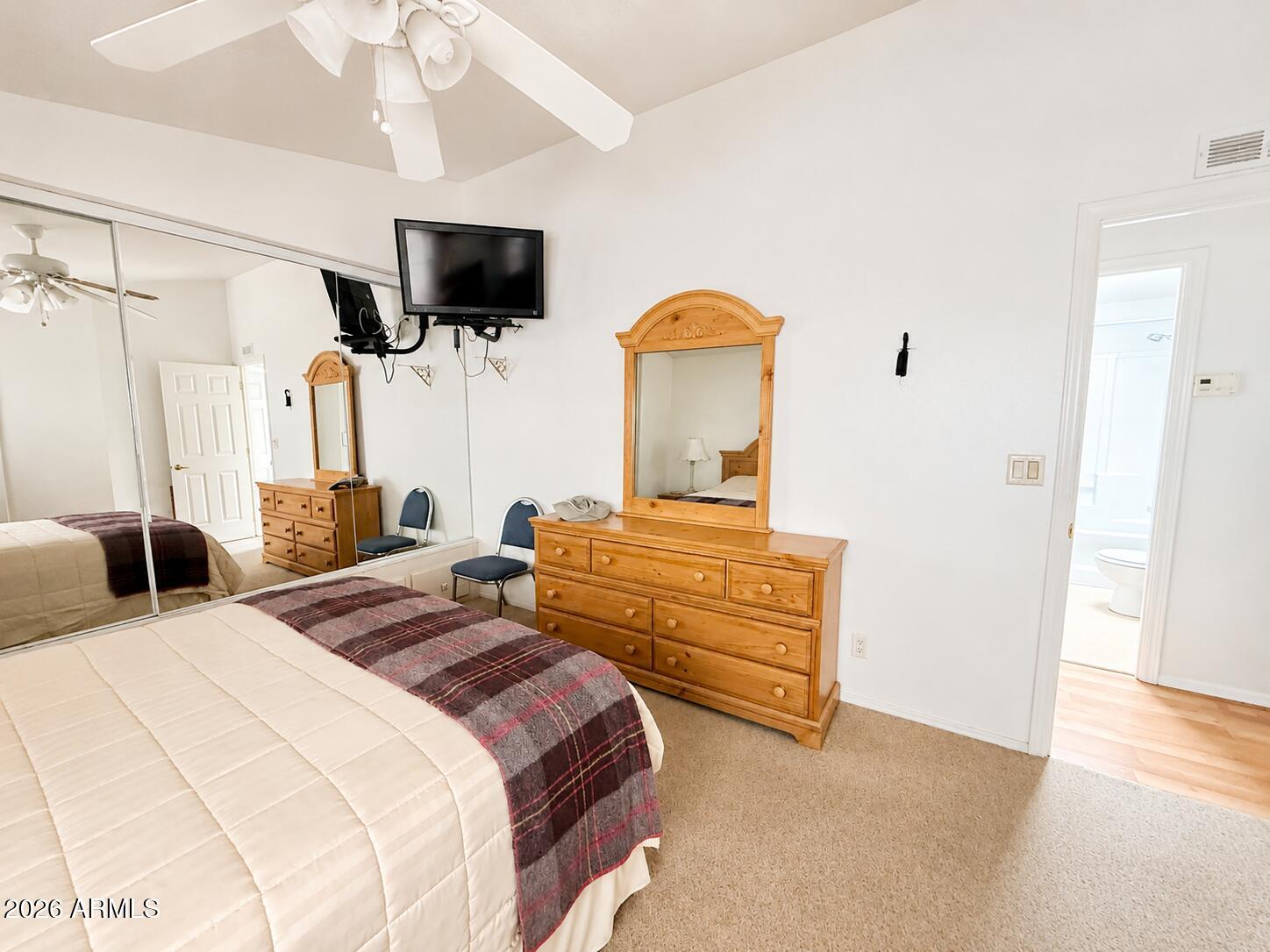 8865 East Baseline Road, Unit 103 Mesa, AZ 85209 - Photo 19 of 47 a bedroom with bed and flat screen tv