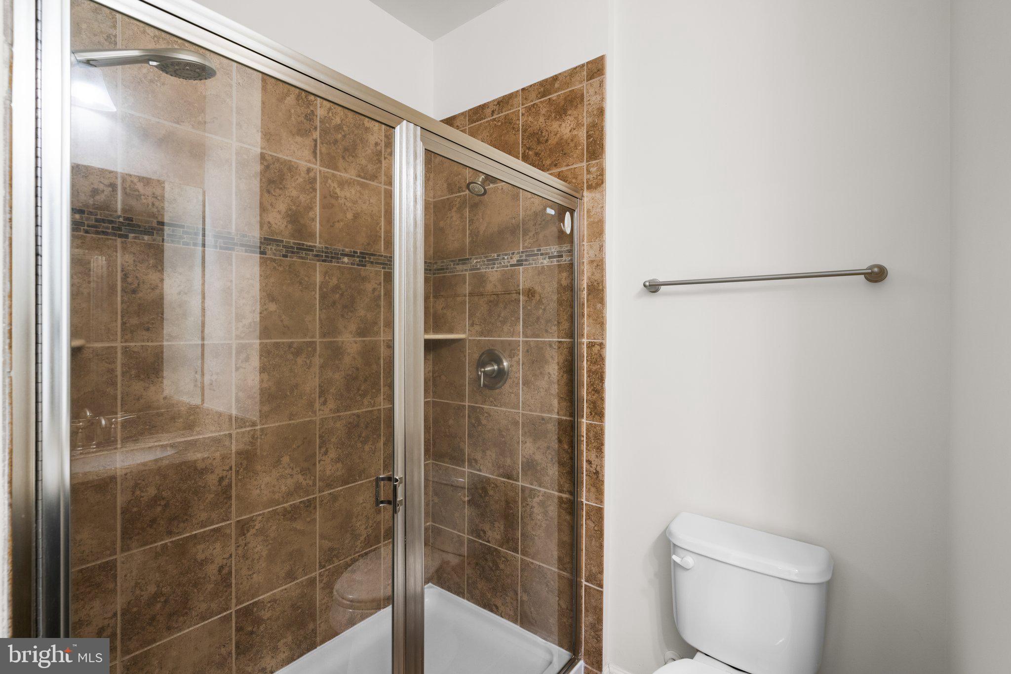 7345 Old Calvary Road Hanover, MD 21076 - Photo 19 of 44 Walk-in shower and extensive tile work