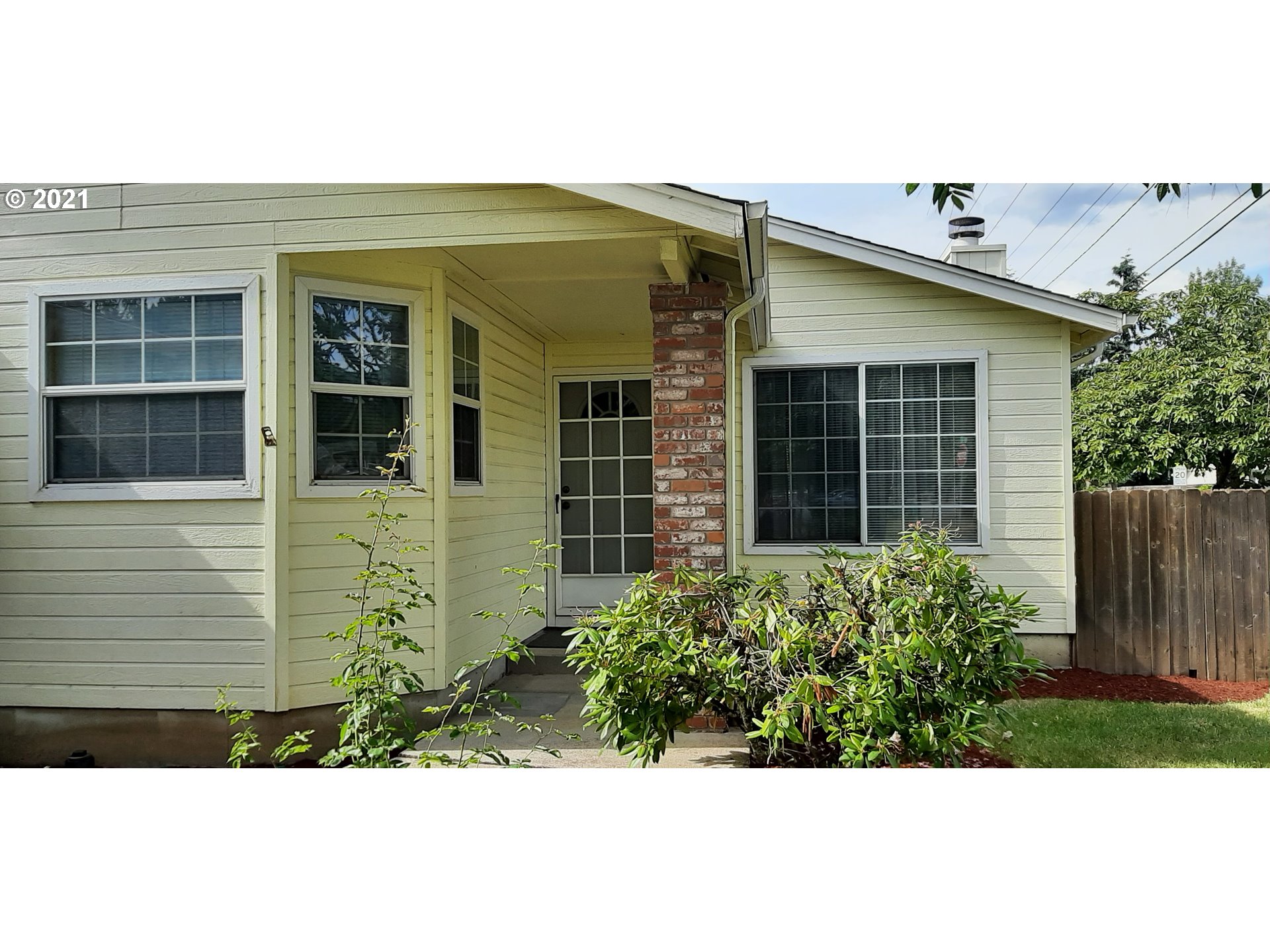 6596 A Street Springfield, OR 97478 - Photo 3 of 32 a front view of a house with a garden