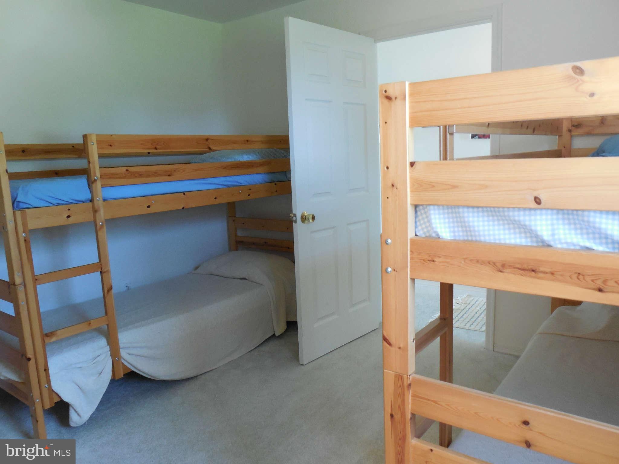 1520 Deep Point Road Woolford, MD 21677 - Photo 11 of 29 a bedroom with a bunk bed and a dresser