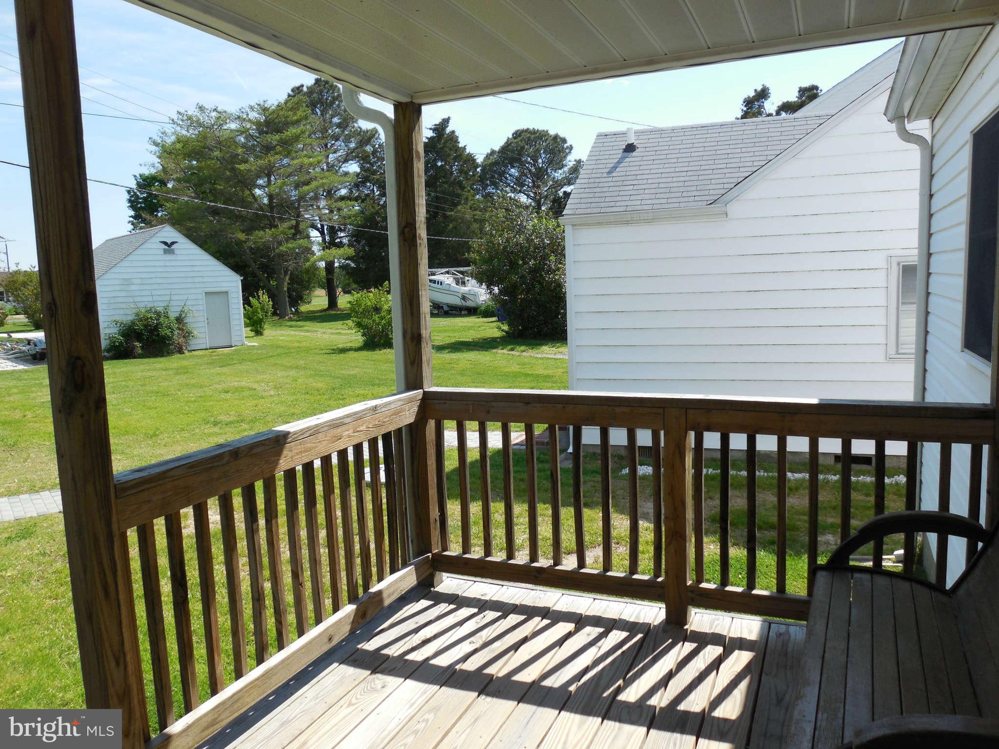 1520 Deep Point Road Woolford, MD 21677 - Photo 18 of 29 a view of a wooden roof deck
