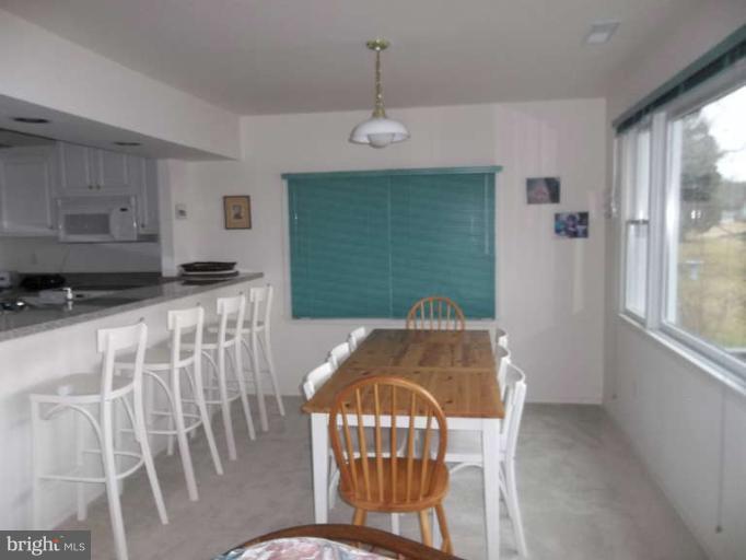 1520 Deep Point Road Woolford, MD 21677 - Photo 26 of 29 a view of a dining room with furniture window and outside view