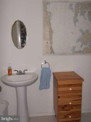 1520 Deep Point Road Woolford, MD 21677 - Photo 27 of 29 a bathroom with a sink and a mirror