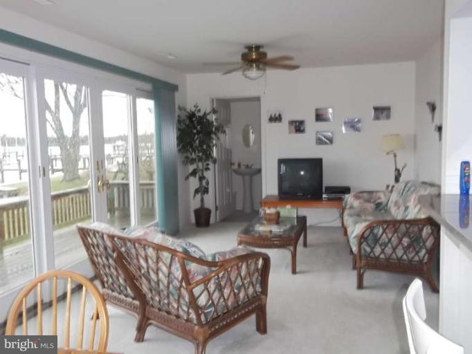 1520 Deep Point Road Woolford, MD 21677 - Photo 6 of 29 a living room with furniture and a fireplace
