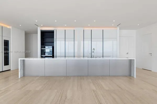 a large white room with wooden floor