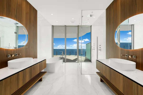 a bathroom with a double vanity sink mirror and double