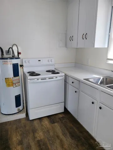 a kitchen with a stove and a sink