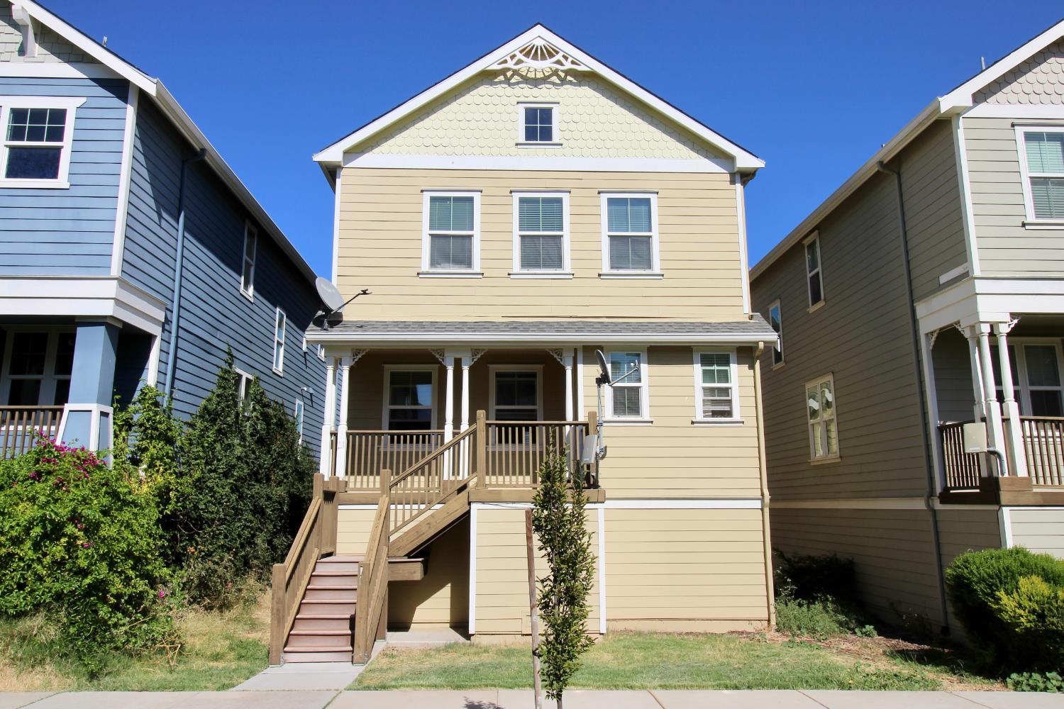 a front view of a house with a yard