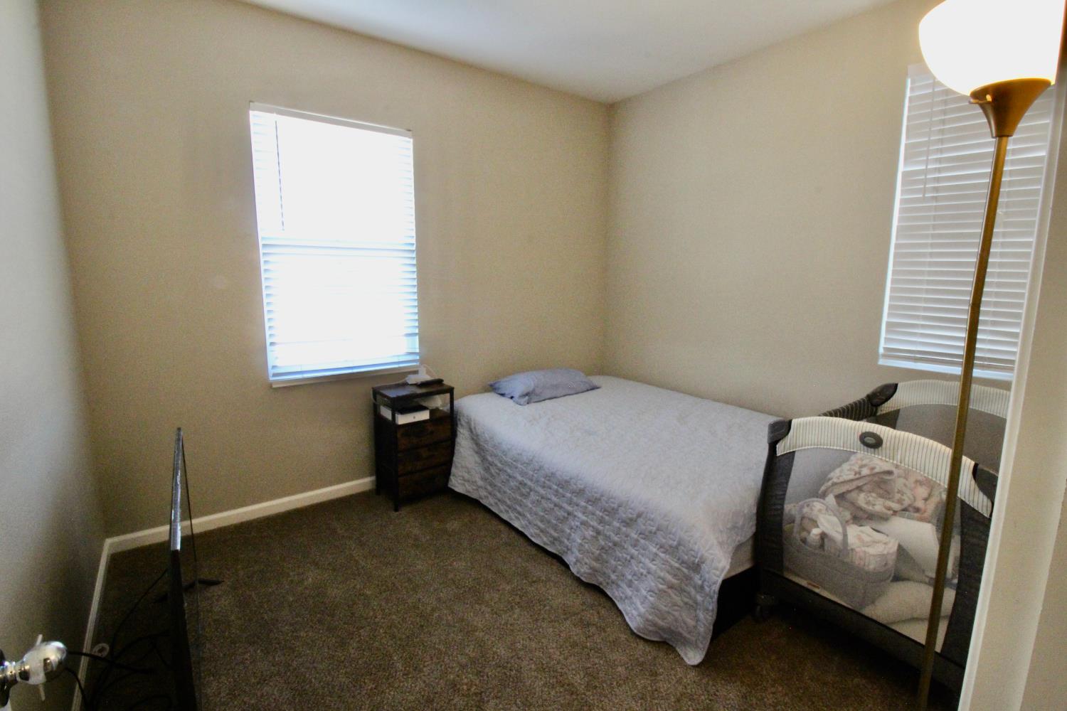 706 Annemarie Way Isleton, CA 95641 - Photo 14 of 21 a bedroom with a bed and a window
