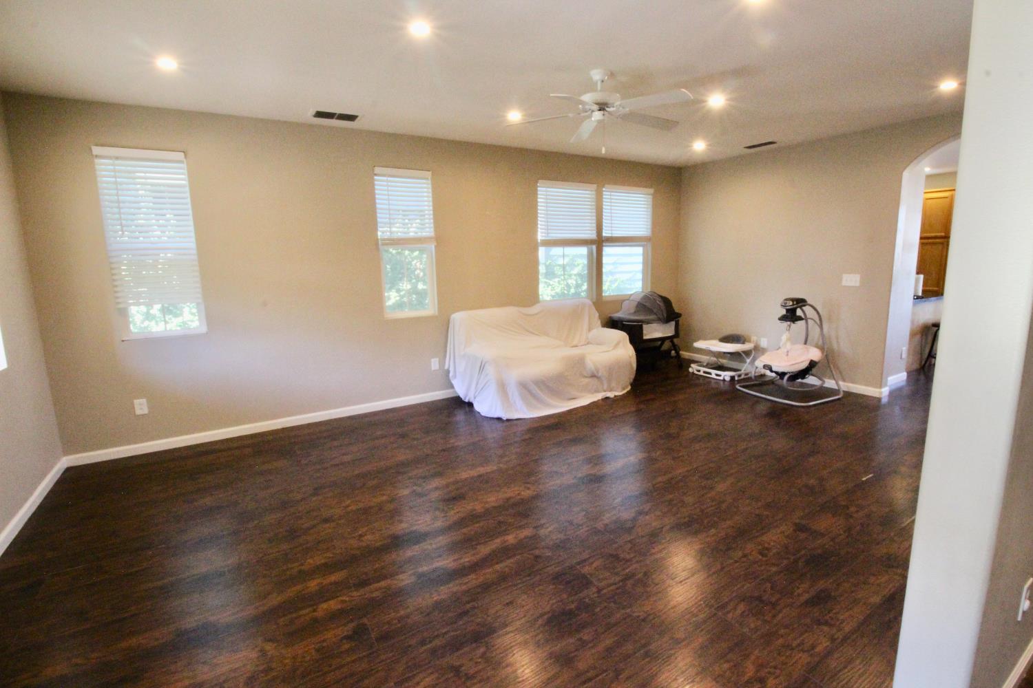 706 Annemarie Way Isleton, CA 95641 - Photo 5 of 21 a room with wooden floor and a window