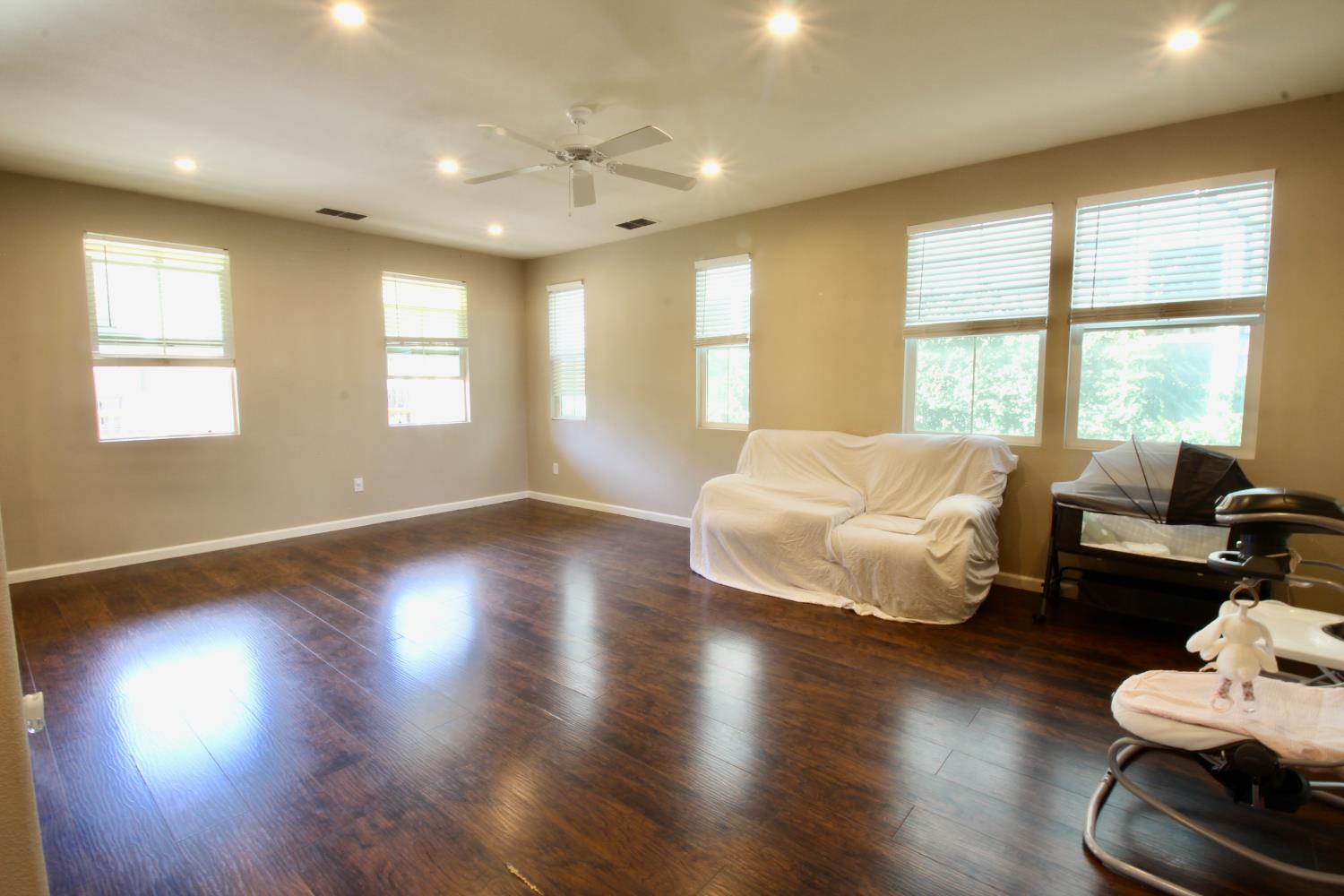 706 Annemarie Way Isleton, CA 95641 - Photo 6 of 21 a spacious bedroom with a bed and wooden floor