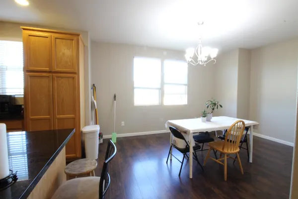 a view of a dining room with furniture and window