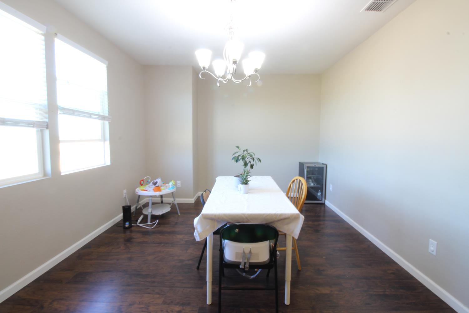 706 Annemarie Way Isleton, CA 95641 - Photo 9 of 21 a view of a dining room with furniture and wooden floor