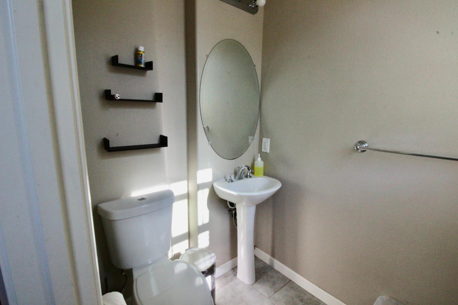 706 Annemarie Way Isleton, CA 95641 - Photo 10 of 21 a bathroom with a sink and a mirror