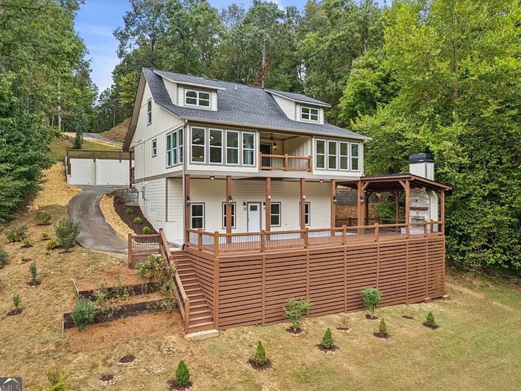 105 West Riveredge Drive Ellijay, GA 30536 - Photo 2 of 56 a front view of a house with a yard
