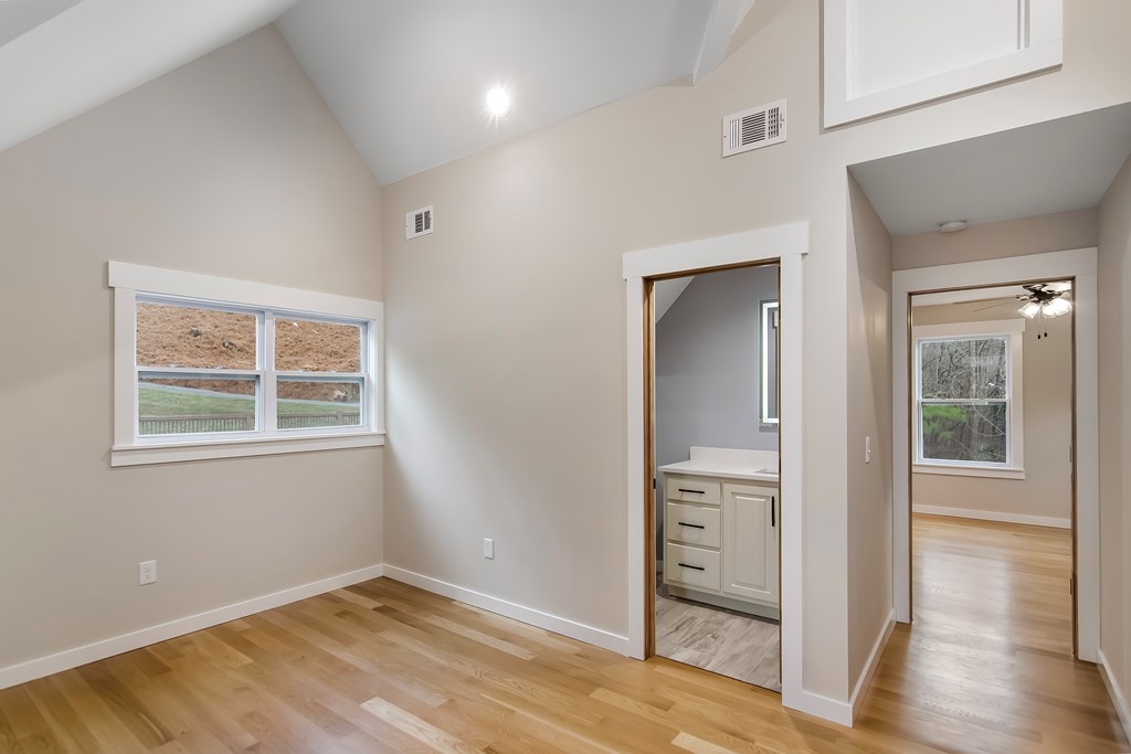 105 West Riveredge Drive Ellijay, GA 30536 - Photo 42 of 56 a view of an empty room with window and wooden floor