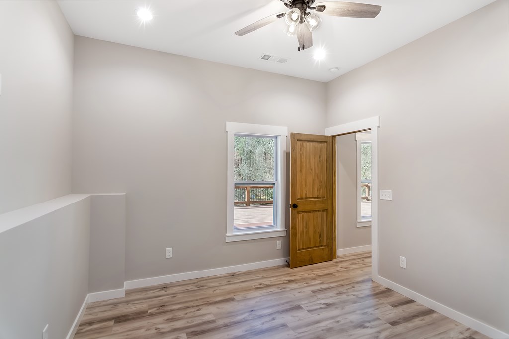 105 West Riveredge Drive Ellijay, GA 30536 - Photo 48 of 56 wooden floor in an empty room with a window
