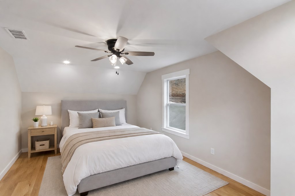 105 West Riveredge Drive Ellijay, GA 30536 - Photo 50 of 56 a bedroom with a large bed and a ceiling fan