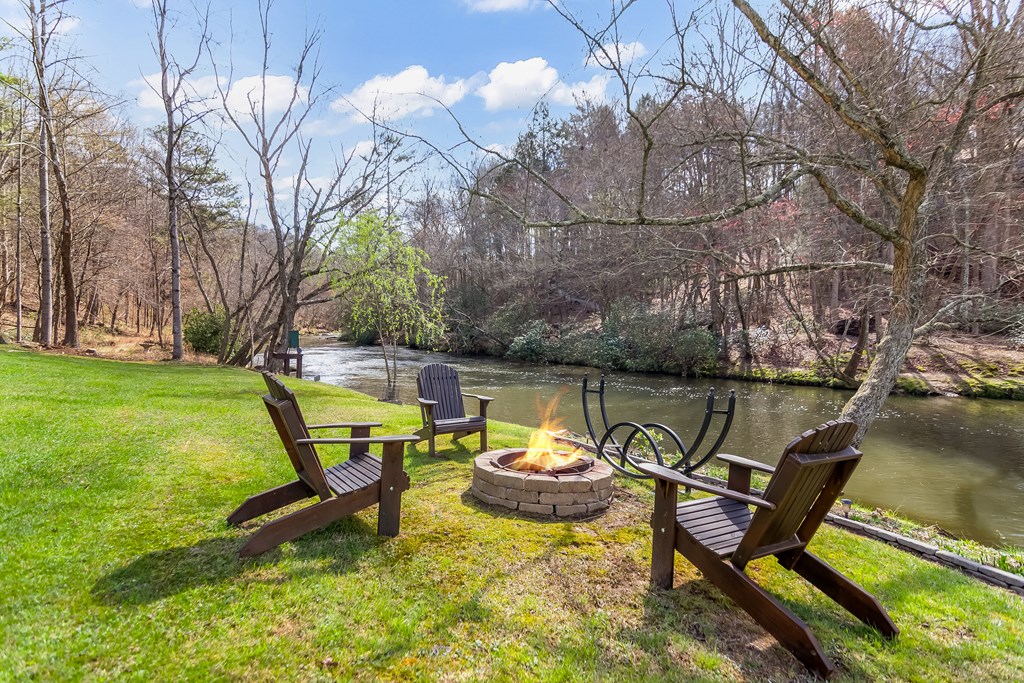 105 West Riveredge Drive Ellijay, GA 30536 - Photo 5 of 56 a view of a swimming pool with a lounge chairs