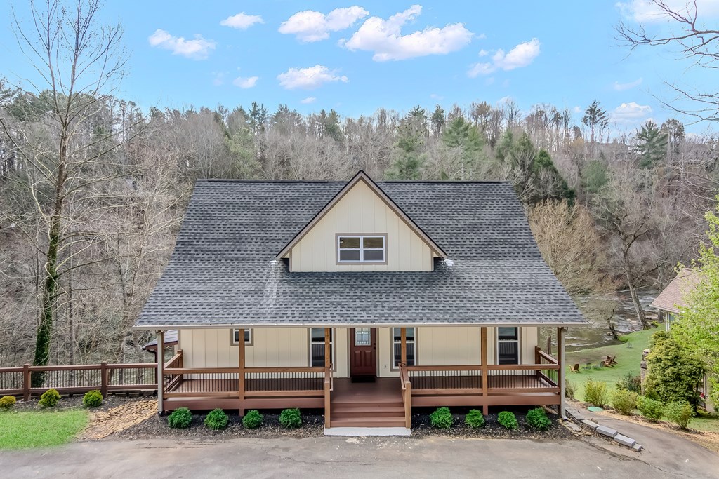 105 West Riveredge Drive Ellijay, GA 30536 - Photo 53 of 56 a front view of a house with trees