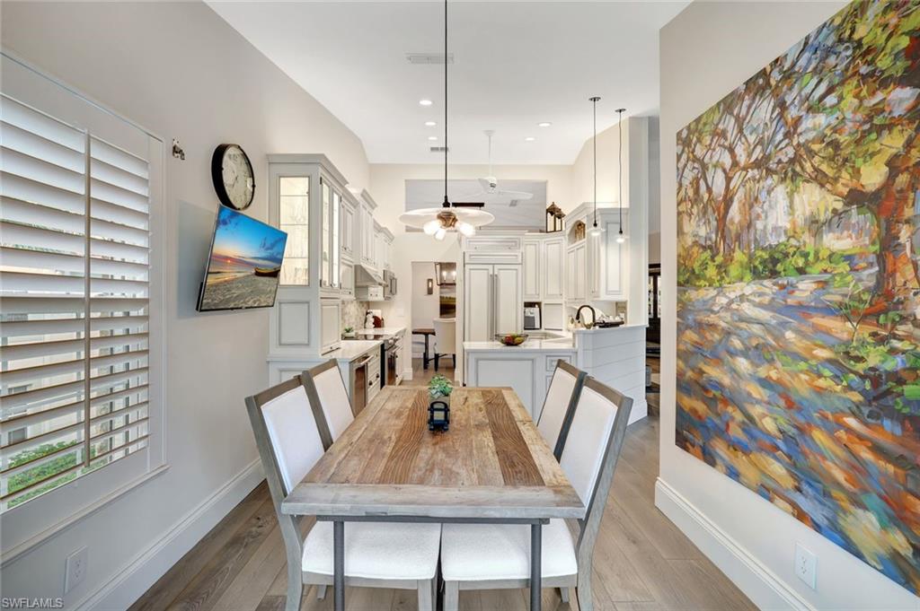 2540 Talon Court, Unit 504 Naples, FL 34105 - Photo 13 of 31 Club Room with Pecky Cypress walls, brick tile flooring. Fabulous preserve views. Vaulted shiplap/beam ceiling treatments