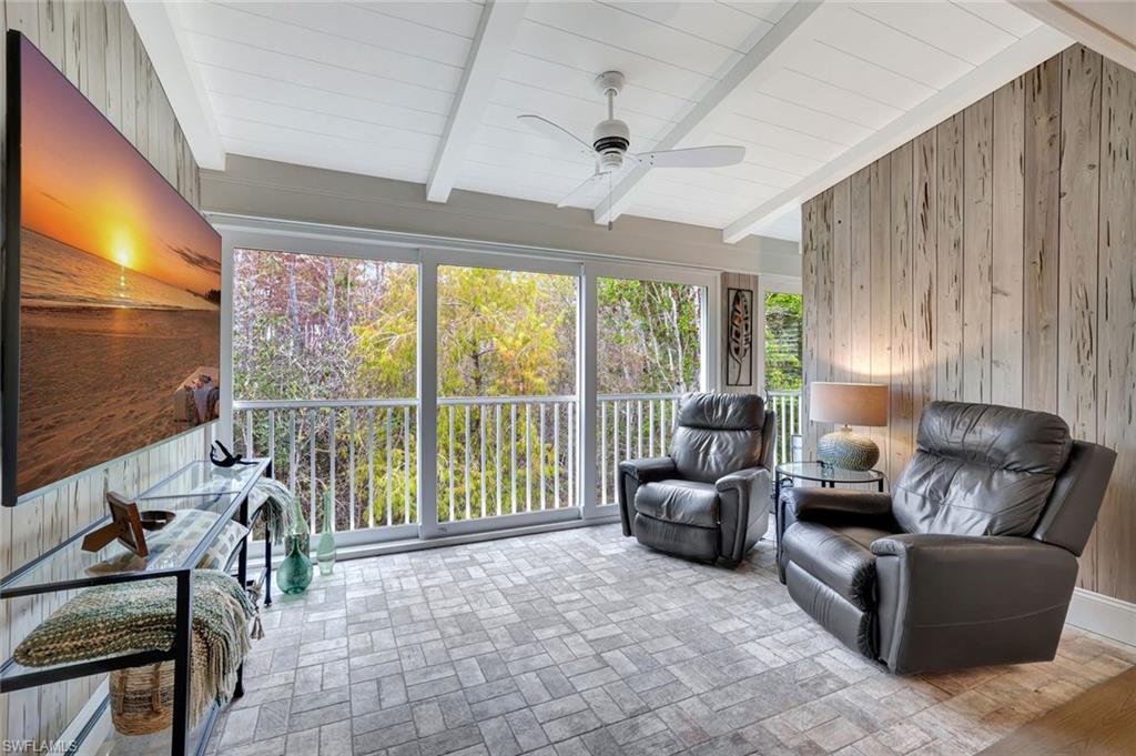 2540 Talon Court, Unit 504 Naples, FL 34105 - Photo 14 of 31 Club Room with Pecky Cypress walls, brick tile flooring. Fabulous preserve views. Vaulted shiplap/beam ceiling treatments