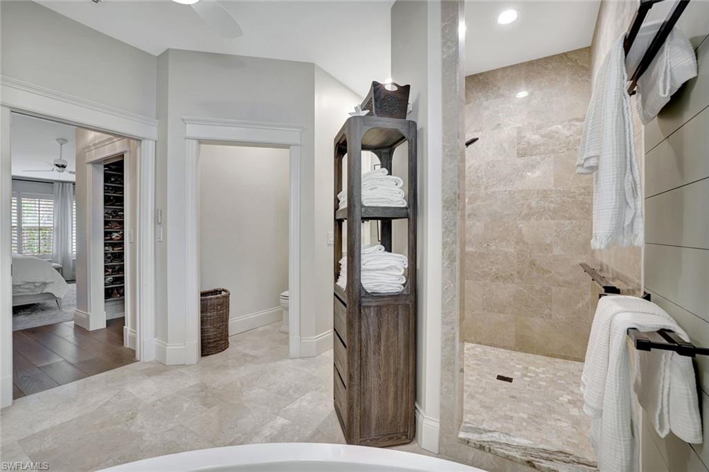 2540 Talon Court, Unit 504 Naples, FL 34105 - Photo 18 of 31 Bedroom with shiplap walls, nice light, custom closet system. Reclaimed wood floors.