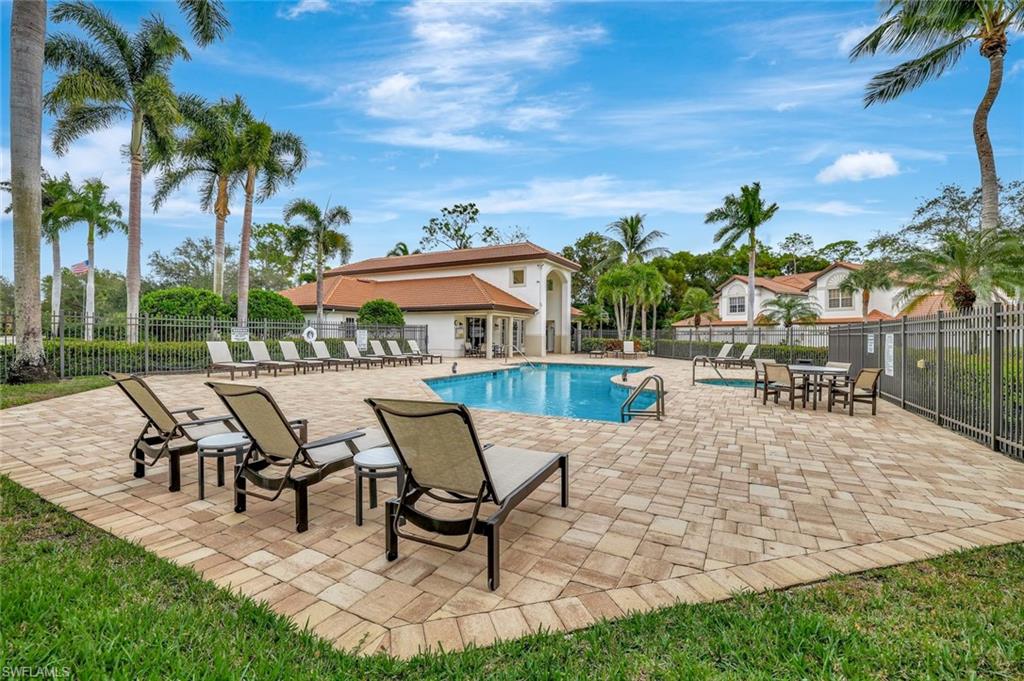 2540 Talon Court, Unit 504 Naples, FL 34105 - Photo 24 of 31 Community pool featuring a patio area