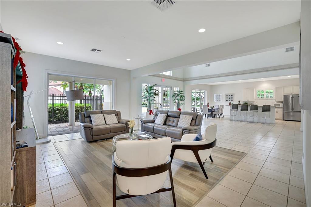 2540 Talon Court, Unit 504 Naples, FL 34105 - Photo 26 of 31 Living room featuring light wood-style floors, healthy amount of natural light, and recessed lighting