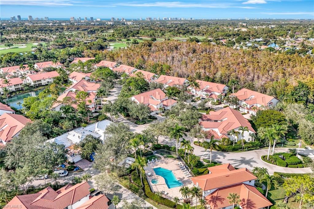 2540 Talon Court, Unit 504 Naples, FL 34105 - Photo 30 of 31 Aerial perspective of suburban area with city skyline