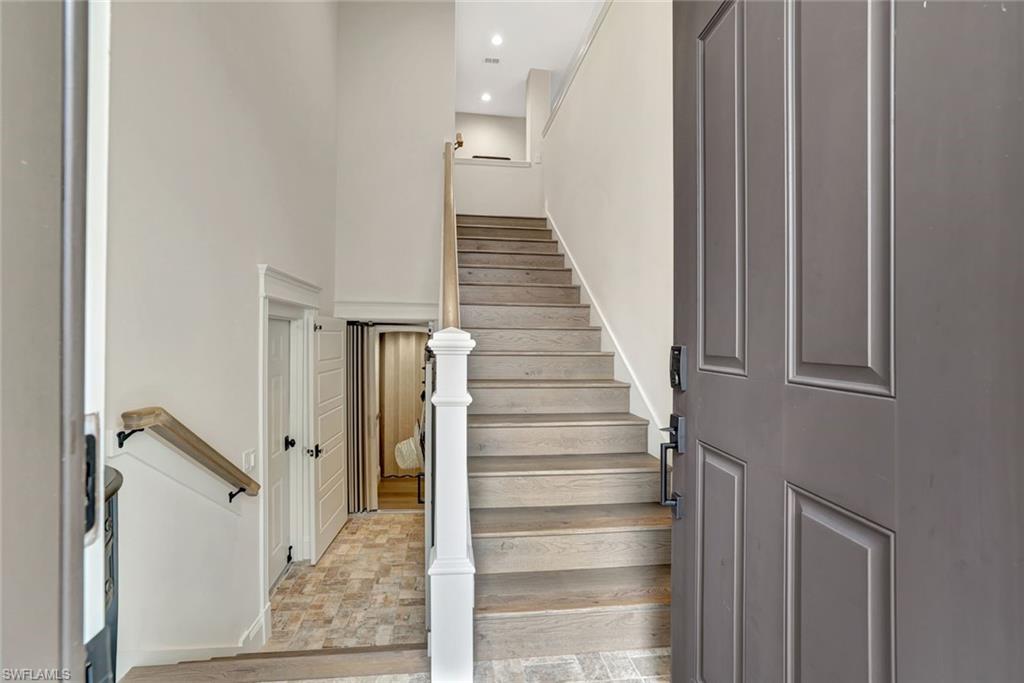 2540 Talon Court, Unit 504 Naples, FL 34105 - Photo 4 of 31 Interior entrance opens to the garage, private elevator and stairs to the main living level. Rails and treds all updated