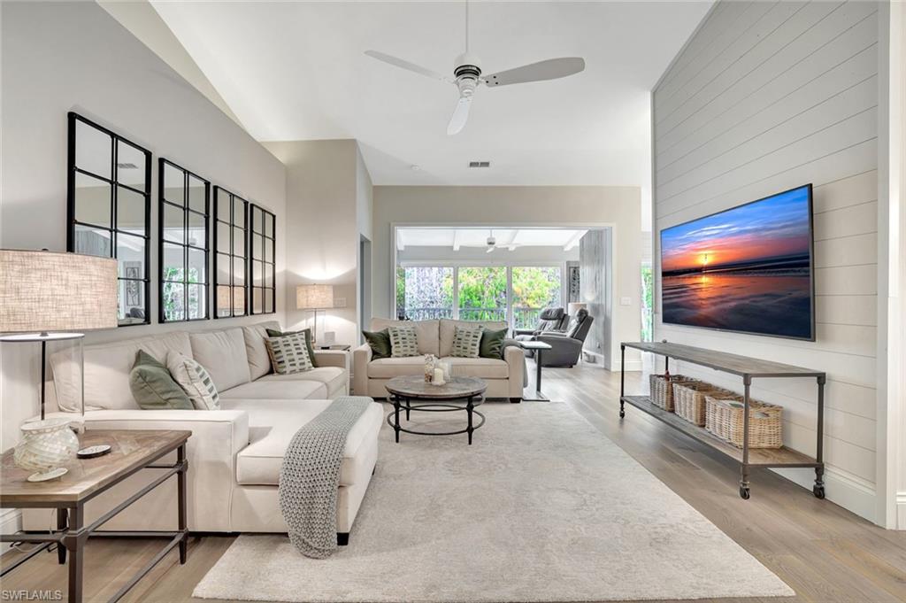2540 Talon Court, Unit 504 Naples, FL 34105 - Photo 5 of 31 Great Room Featuring reclaimed wood flooring with volume ceilings