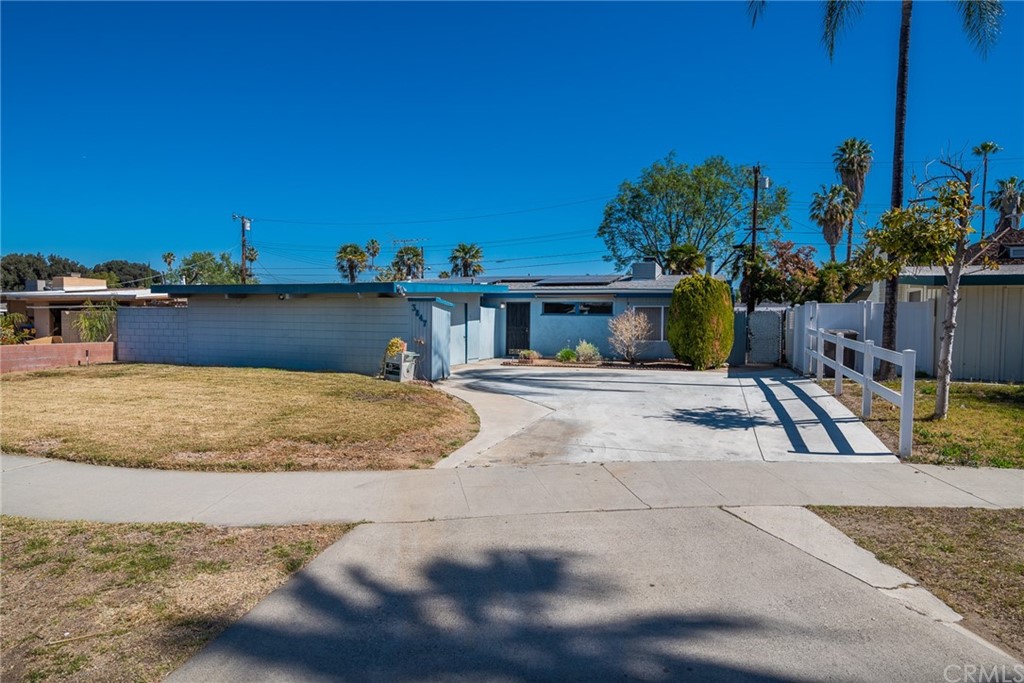 3847 Gates Place Riverside, CA 92504 - Photo 1 of 1 a view of a swimming pool with a lawn chairs