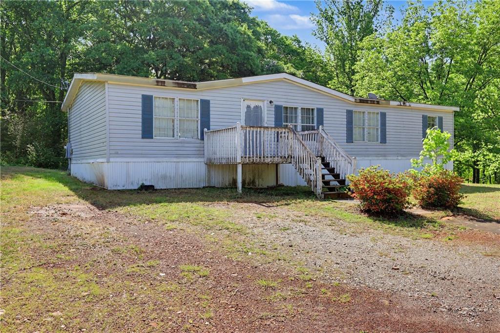 249 John Golden Road Temple, GA 30179 - Photo 2 of 45 a view of a house with a yard and sitting area