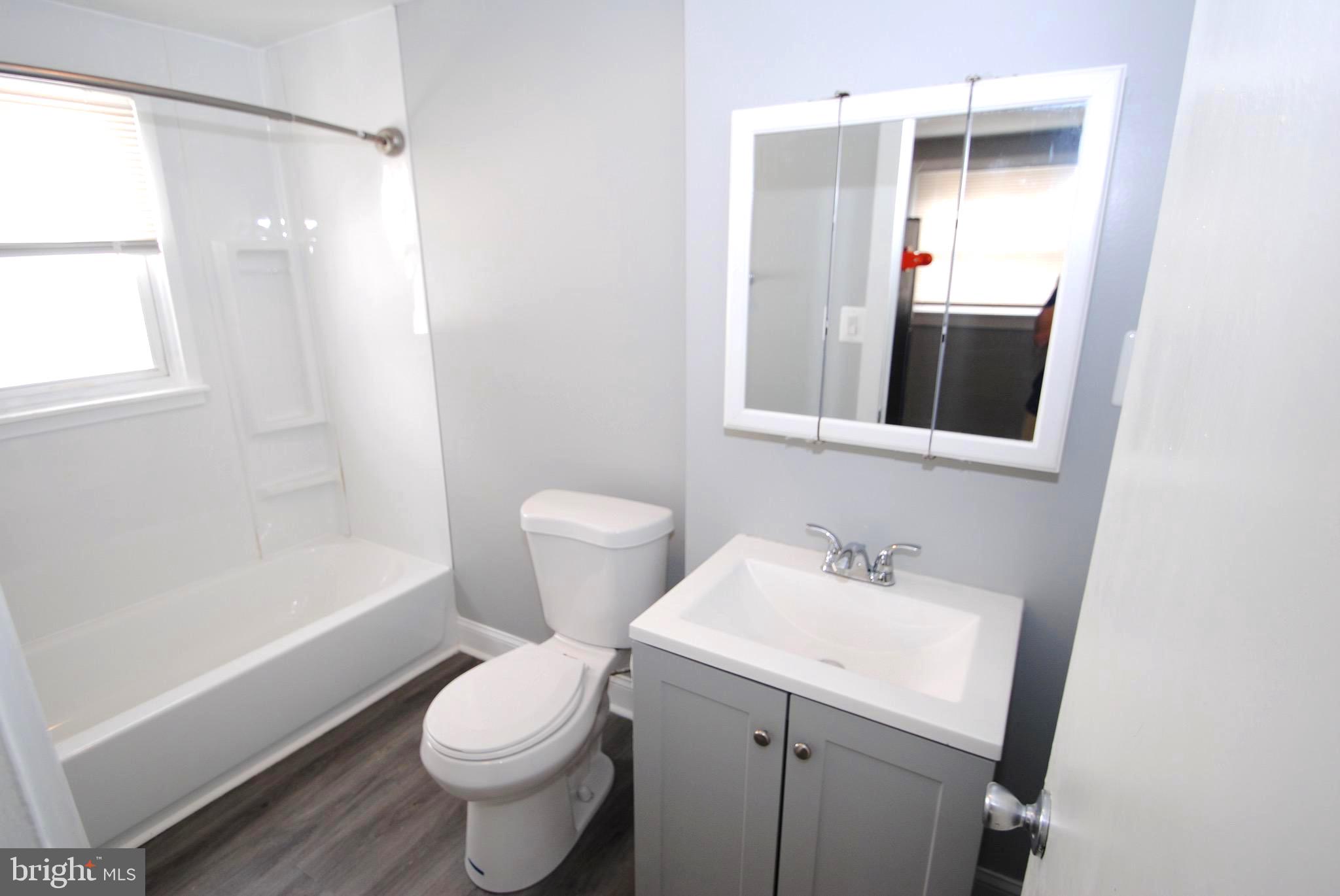 374 Farnsworth Avenue Bordentown, NJ 08505 - Photo 7 of 7 a bathroom with a sink toilet and shower
