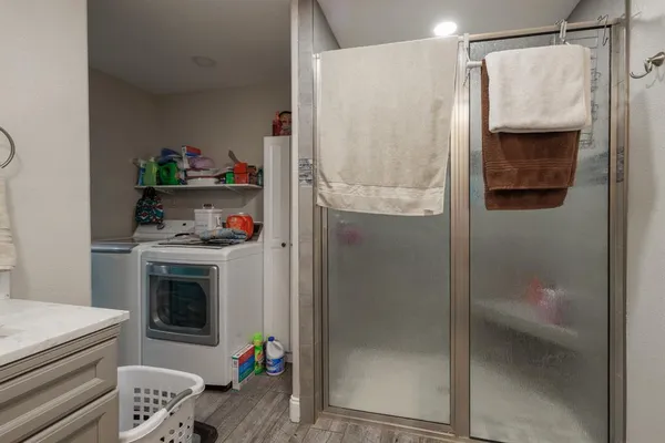 a kitchen with stainless steel appliances a refrigerator and a stove