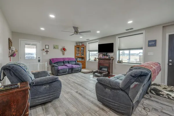 a living room with furniture window and a flat screen tv