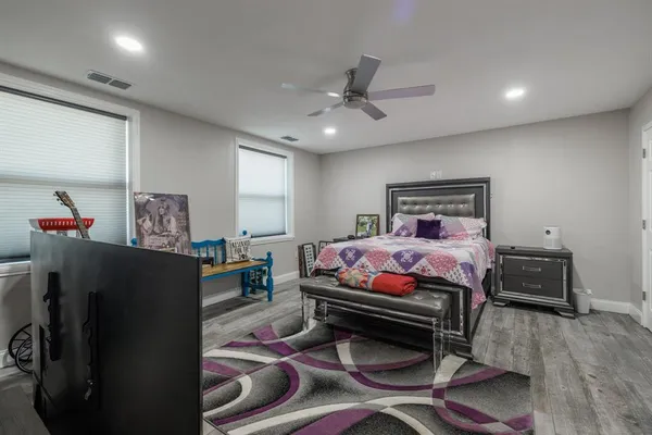 a bedroom with furniture and a window