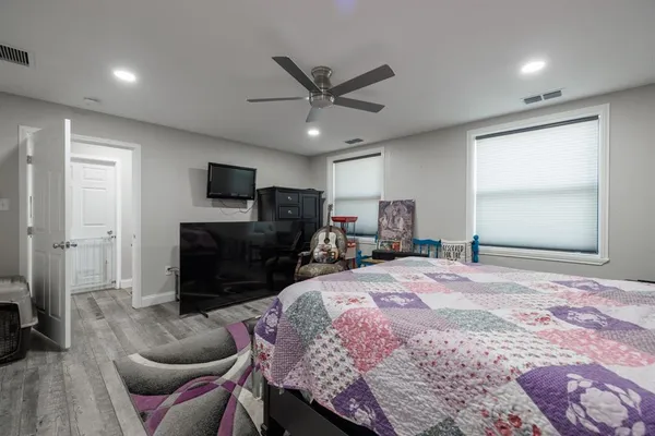 a bedroom with a bed and furniture