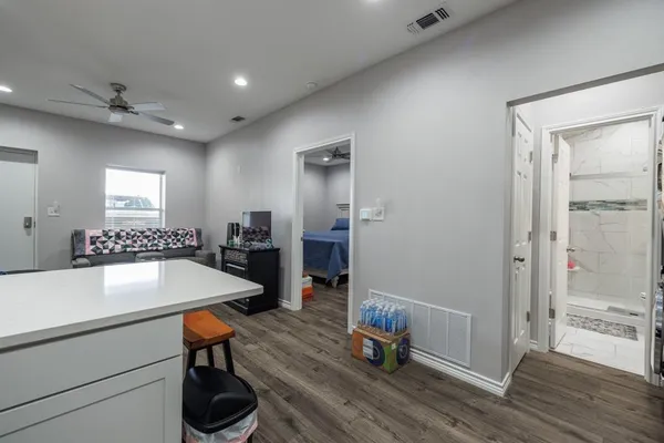 a room with wooden floor and furniture
