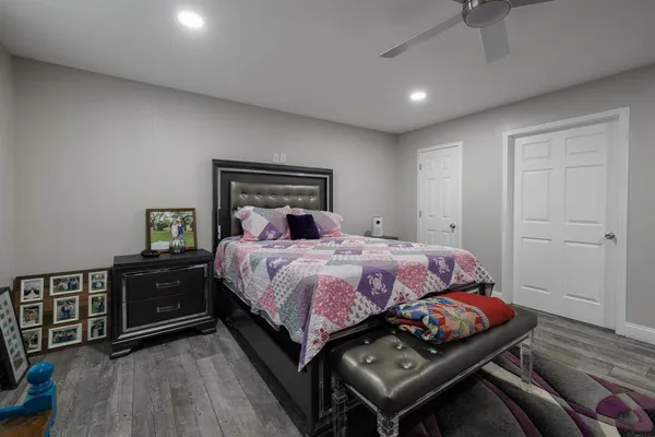 a bedroom with a bed and a dresser