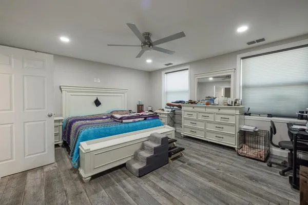 a bedroom with a bed and furniture