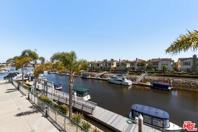 a view of a lake with chairs