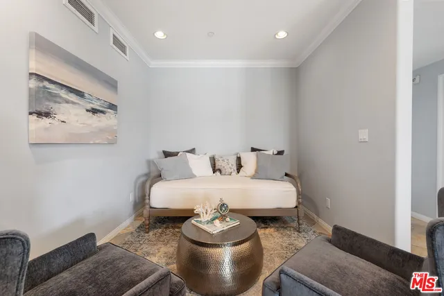 a living room with furniture and a lamp