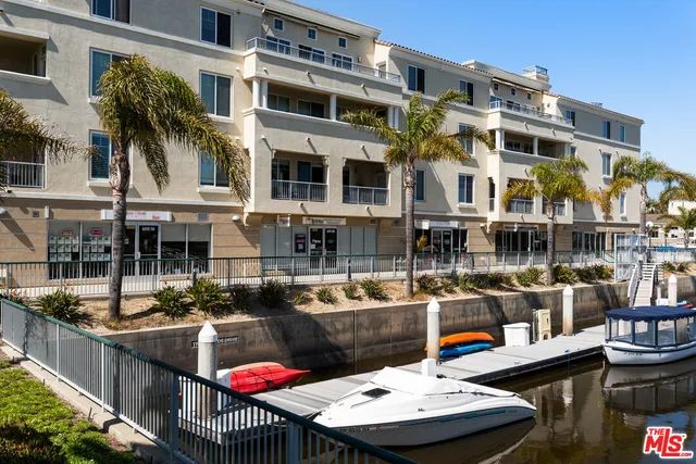 a view of a patio with swimming pool table and chairs