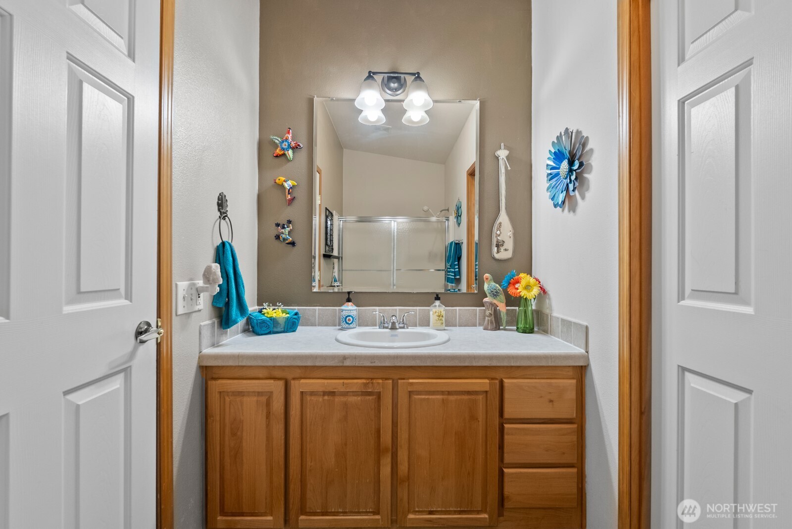 9314 Canyon Road East, Unit 39 Puyallup, WA 98371 - Photo 15 of 27 a bathroom with a sink and a mirror