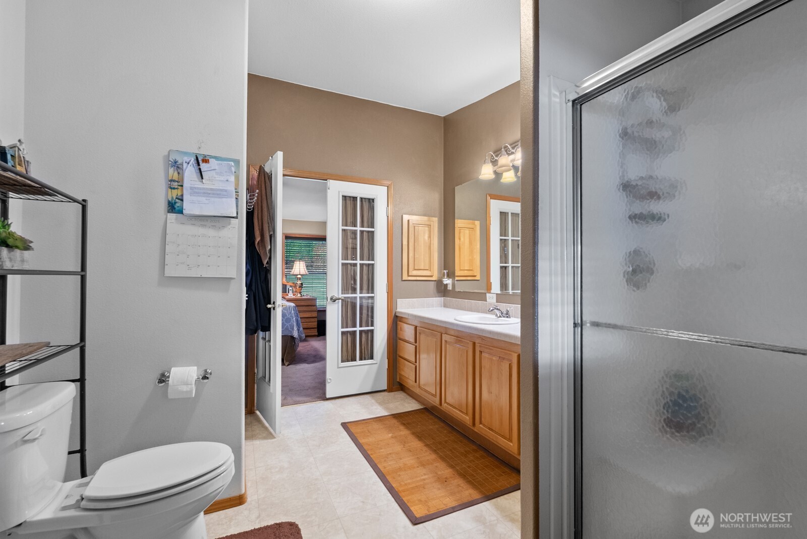 9314 Canyon Road East, Unit 39 Puyallup, WA 98371 - Photo 20 of 27 a bathroom with a shower and a toilet