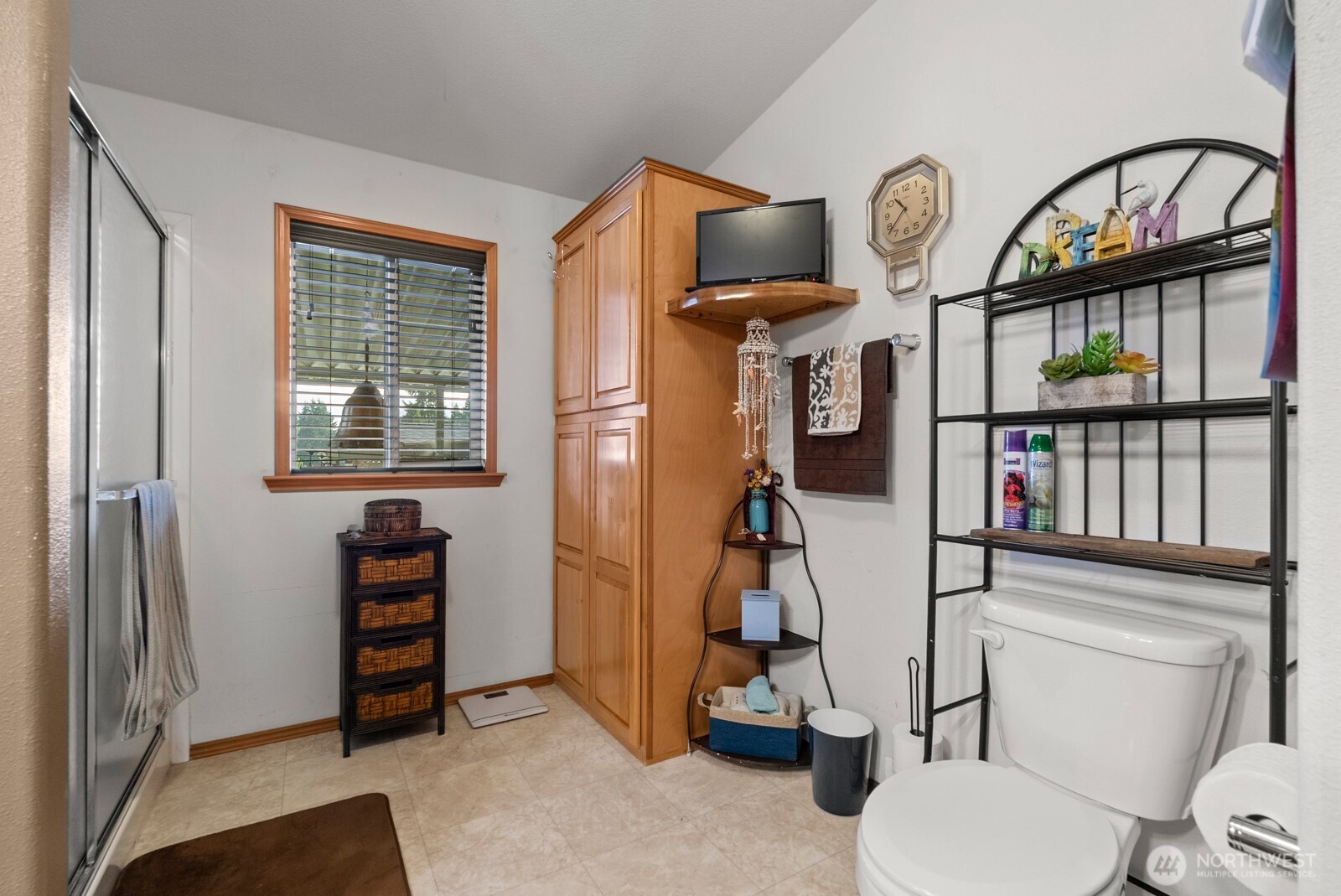 9314 Canyon Road East, Unit 39 Puyallup, WA 98371 - Photo 21 of 27 a living room with furniture a window and a flat tv screen
