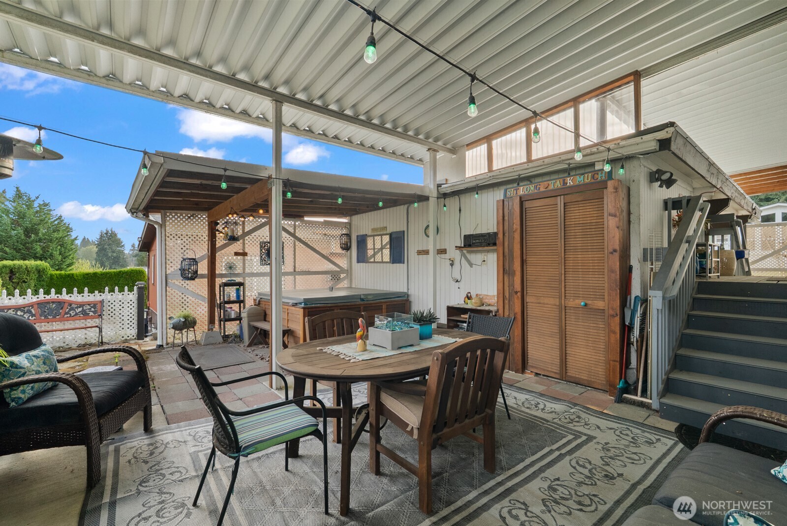 9314 Canyon Road East, Unit 39 Puyallup, WA 98371 - Photo 25 of 27 a view of a chairs and table in a patio