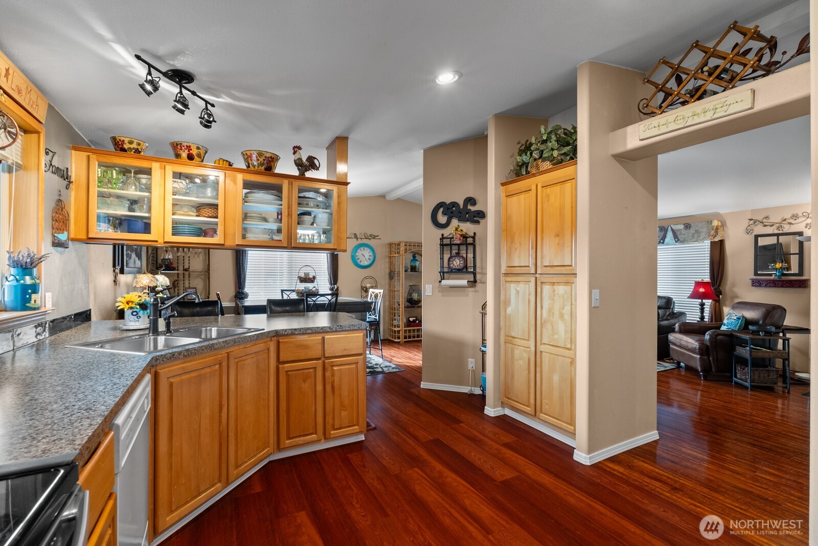9314 Canyon Road East, Unit 39 Puyallup, WA 98371 - Photo 7 of 27 a large kitchen with stainless steel appliances granite countertop a refrigerator and a sink